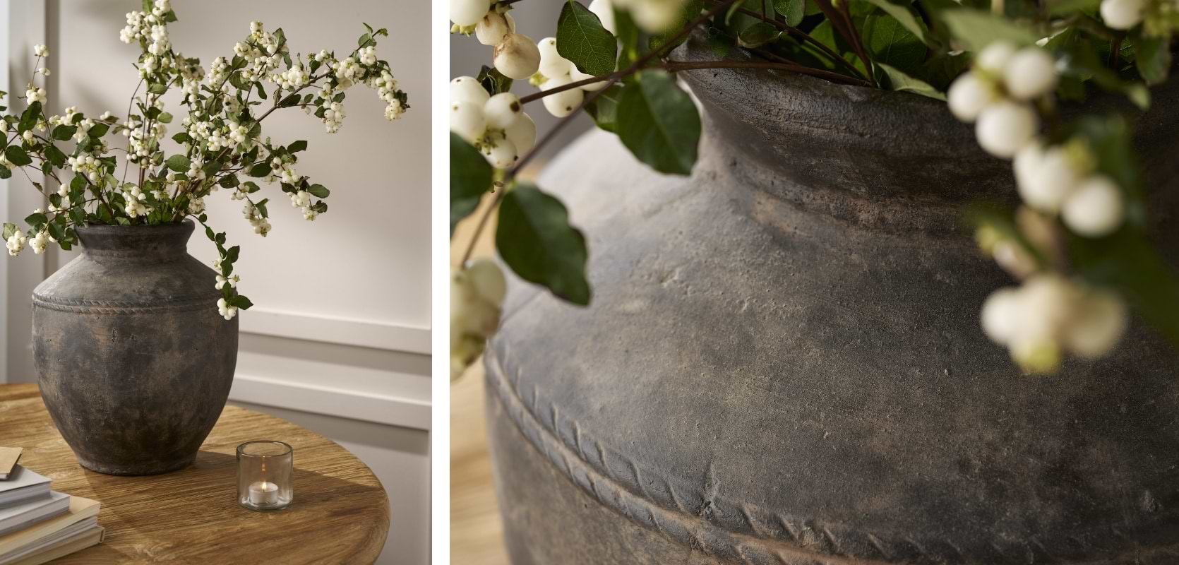 Large antique brown Portesham Vase with stitched detailing, filled with fresh flowers on a side table.