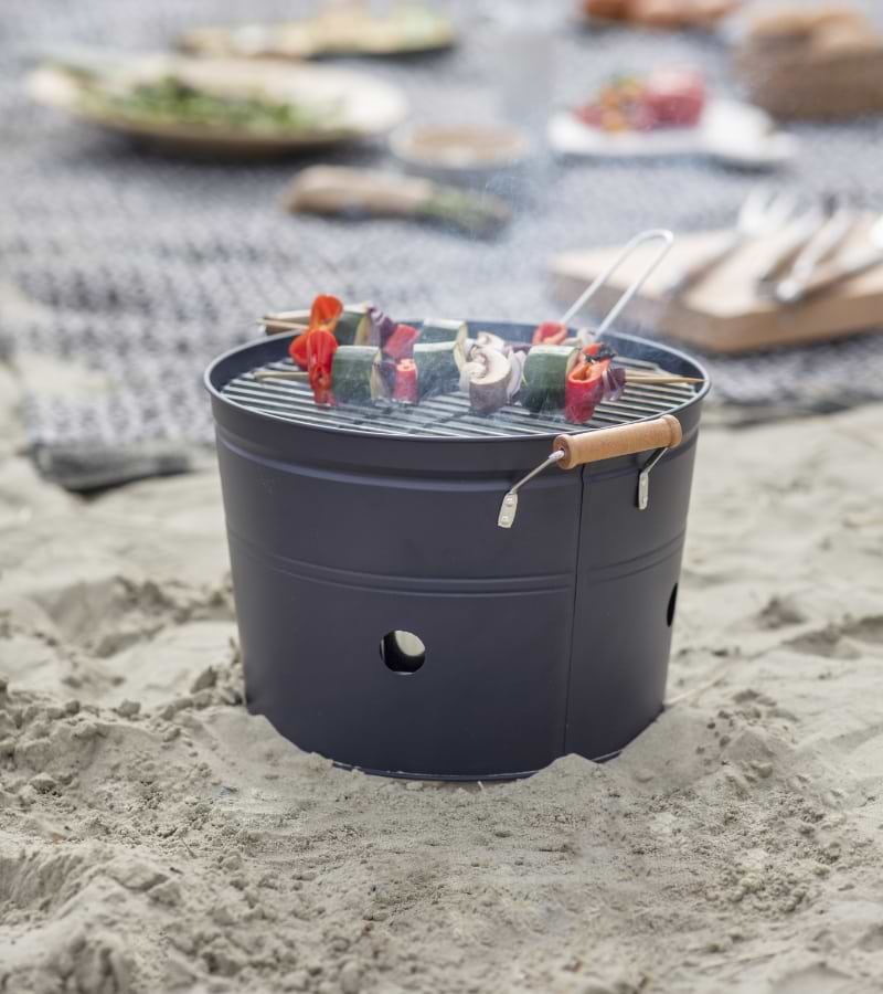 Cleveley Bucket BBQ in Carbon, portable and compact for picnics, beach days, and garden grilling.