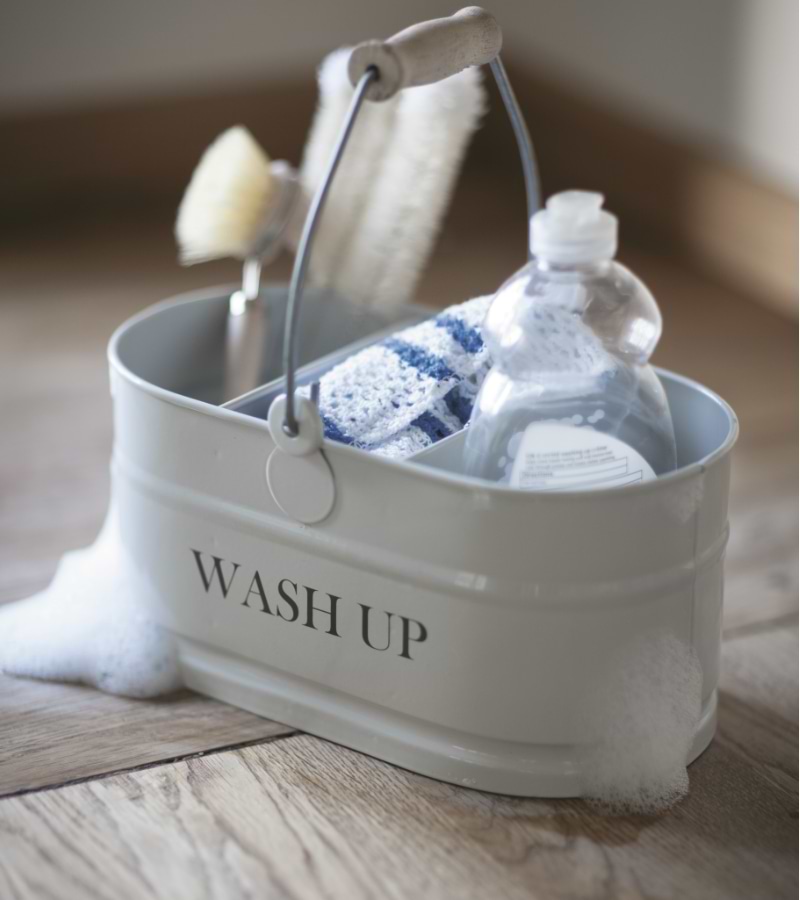 A wash up tidy with washing up items in.