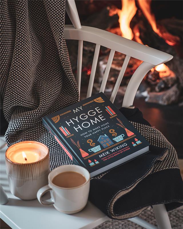A copy of Meik Wiking's book "My Hygge Home" on a chair