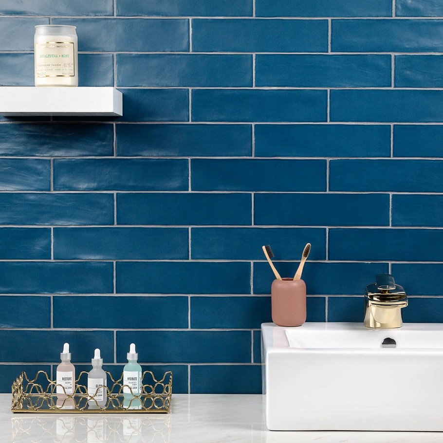 Bayou Marine Ceramic Tile in blue used as a bathroom backsplash on wall