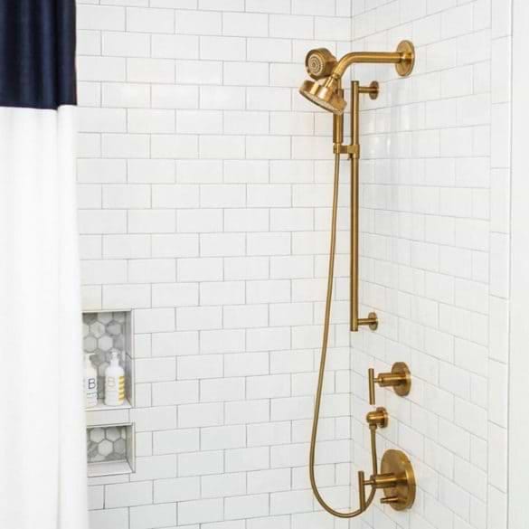 Basic White 3x6 Ceramic Tile used in bathroom with matte gold shower features