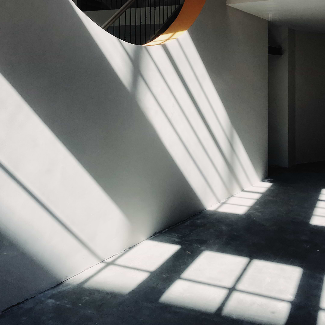 A contemporary, all gray entryway with cement look tile floors.