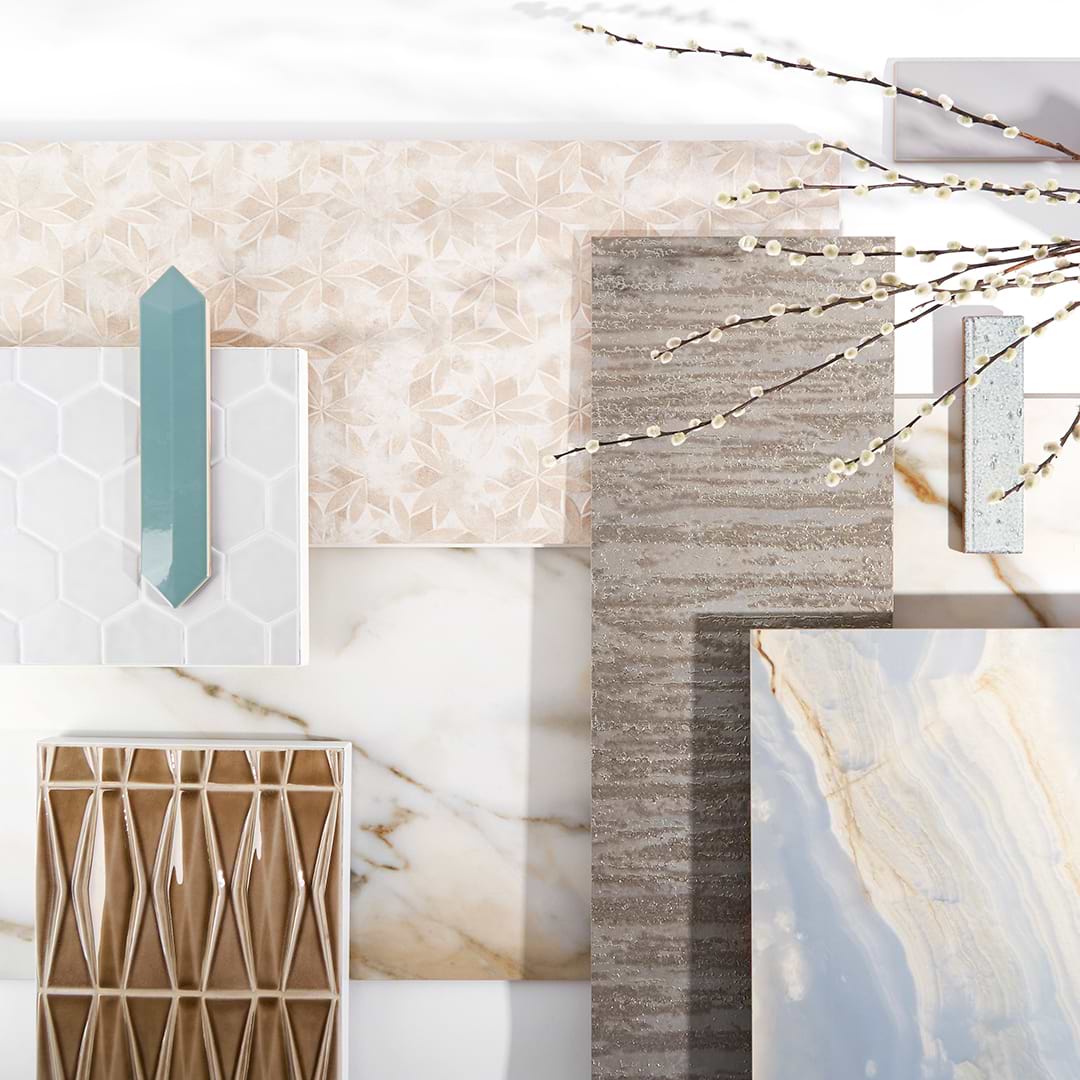 Tiles laid out on the floor in a variety of beige and blue colors
