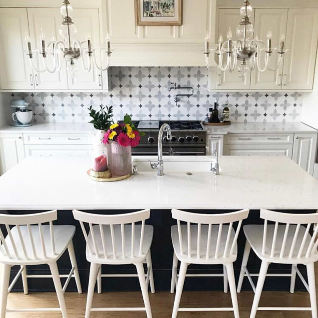 Eveningstar Marble Tile, Polished shown as a stovetop backsplash as well as on the rest of the kitchen wall