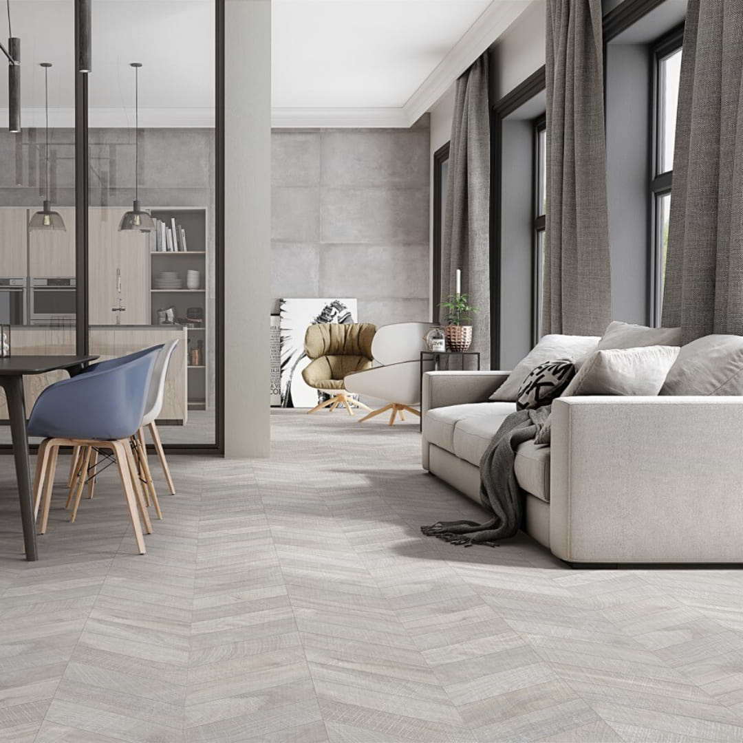 Kenridge Chevron Gray 24x48 Matte Porcelain Tile shown on the floor in a living / dining environment for use on floor or wall