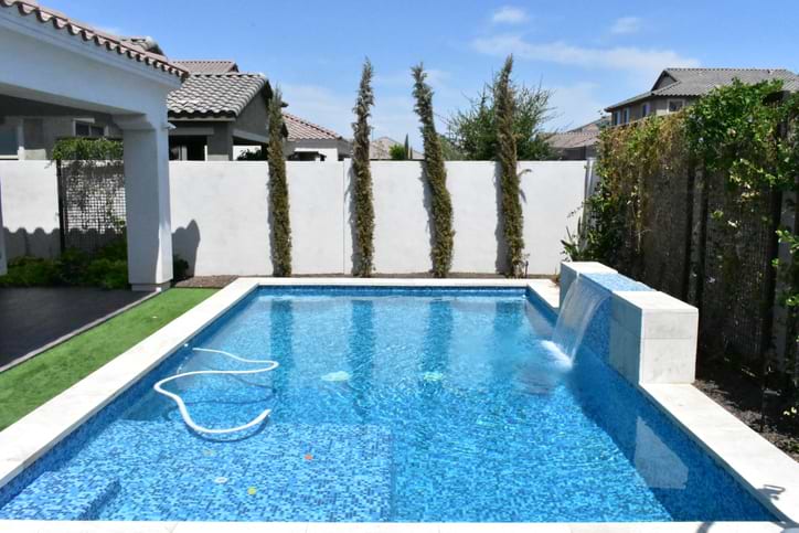 Outdoor swimming pool tile in swimming pool with water feature