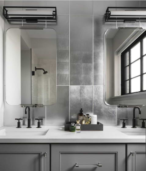 Frosted mirrored glass featured in the bathroom on the wall as a backsplash above the sink unit. 