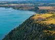 BURNIE, TASMANIA - Mountain and blue sea aerial view