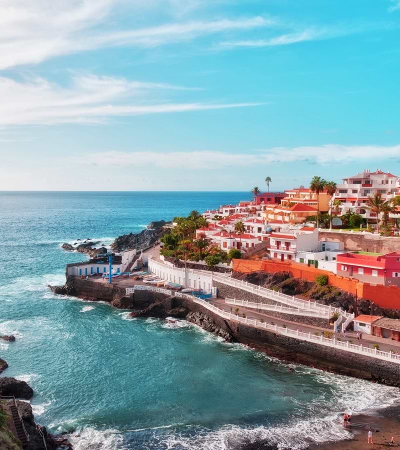 TENERIFE coastal view with buildings on a mountain