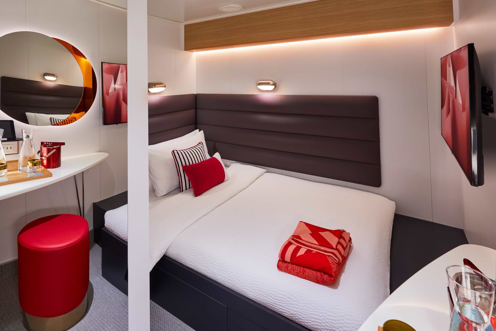 Mood lighting, glam station, and an extra large bed just for you? This is your hangout — in between hanging out all over the ship.