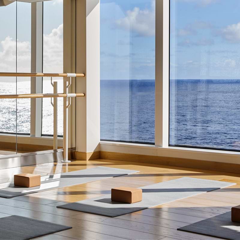 Yoga mats and block by at sea