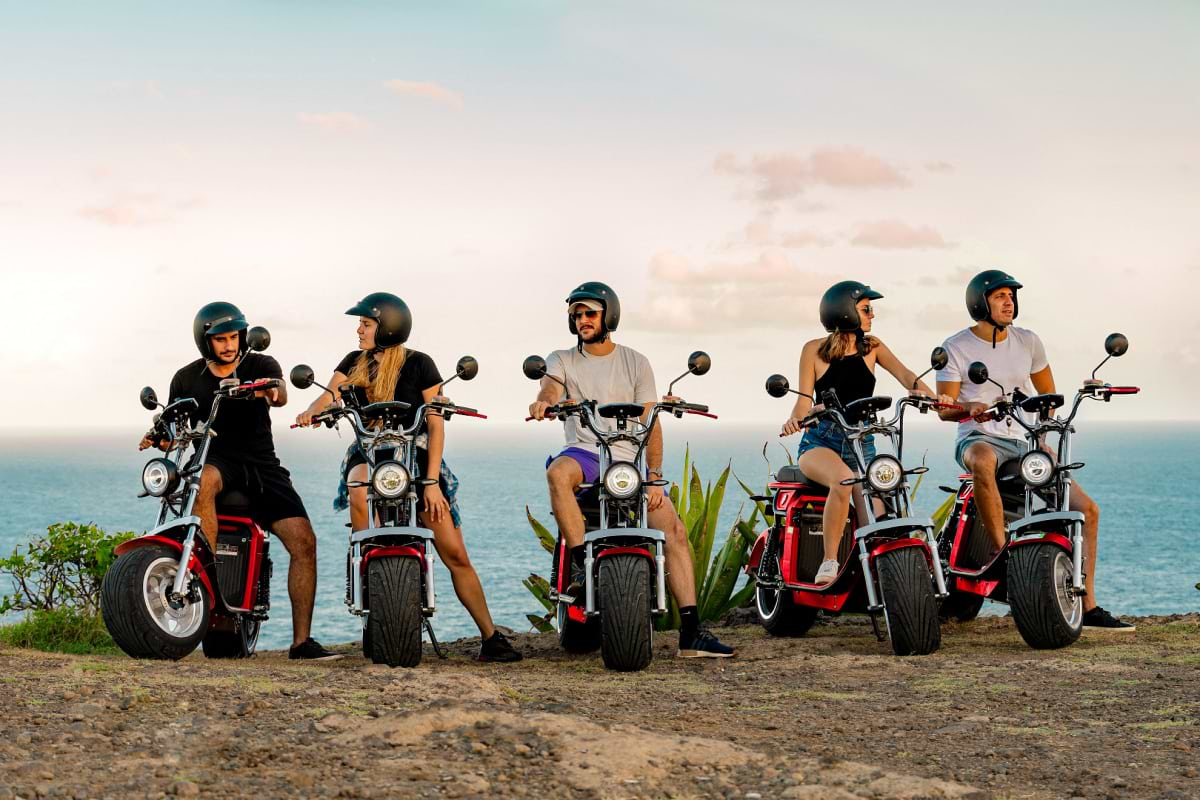 Group of people sitting on electric bikes