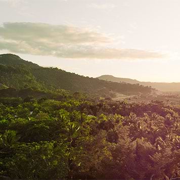Sunset over forest and mountains in Dominican Republic