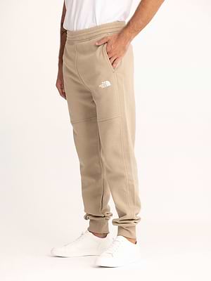 THE NORTH FACE long pants beige small logo מכנס טרנינג ארוך בצבע בז' עם לוגו קטן