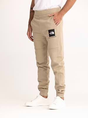 THE NORTH FACE long pants beige black small logo מכנס טרנינג ארוך בצבע בז' עם ריבוע שחור לוגו קטן