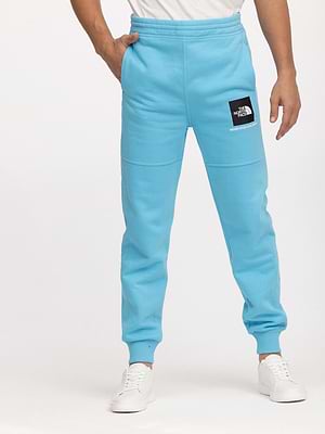 THE NORTH FACE long pants blue small logoמכנס טרנינג ארוך בצבע טורקיז עם ריבוע המותג