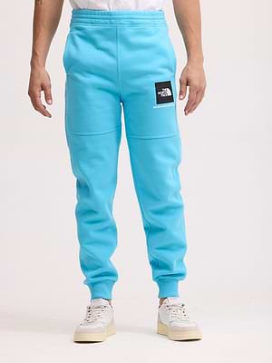 THE NORTH FACE long pants blue small logo מכנס טרנינג ארוך בצבע כחול ניאון עם לוגו קטן