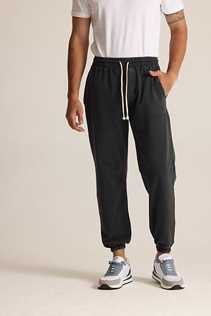 2512 long pants מכנס טרנינג ארוך עם לוגו צידי בצבע שחור אבן