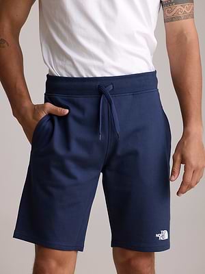 THE NORTH FACE logo pants מכנס קצר בצבע נייבי לוגו צידי לבן